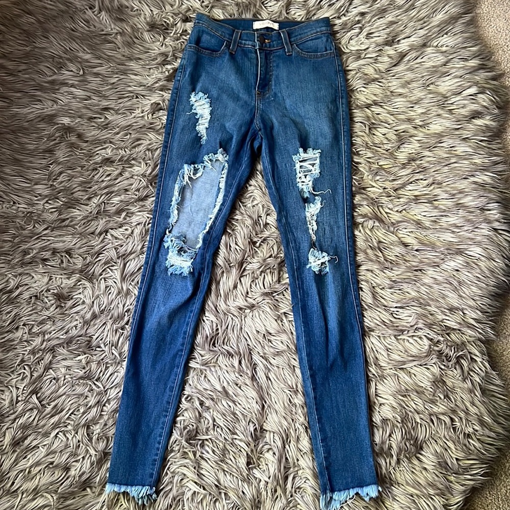 Stretchy distressed denim jeans